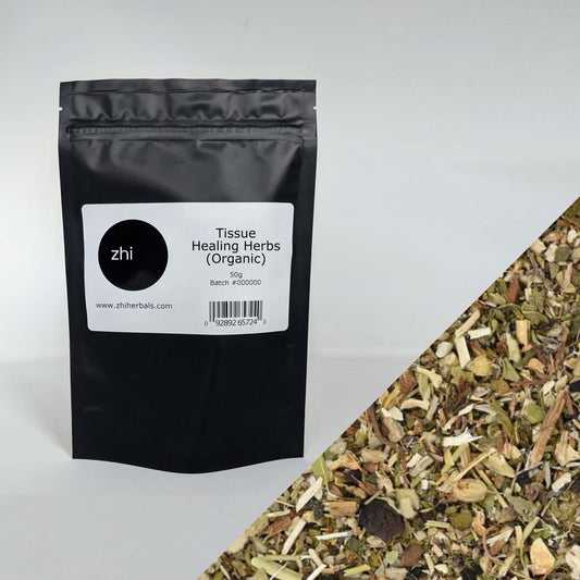 Zhi Herbals Organic Tissue Healing Herbs, 50g black package with label, next to a close-up of the brown herb blend.
