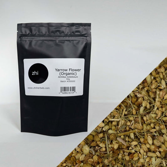 Zhi Herbals Organic Yarrow Flower, 50g black package with label, next to a close-up of the yellow flower texture.