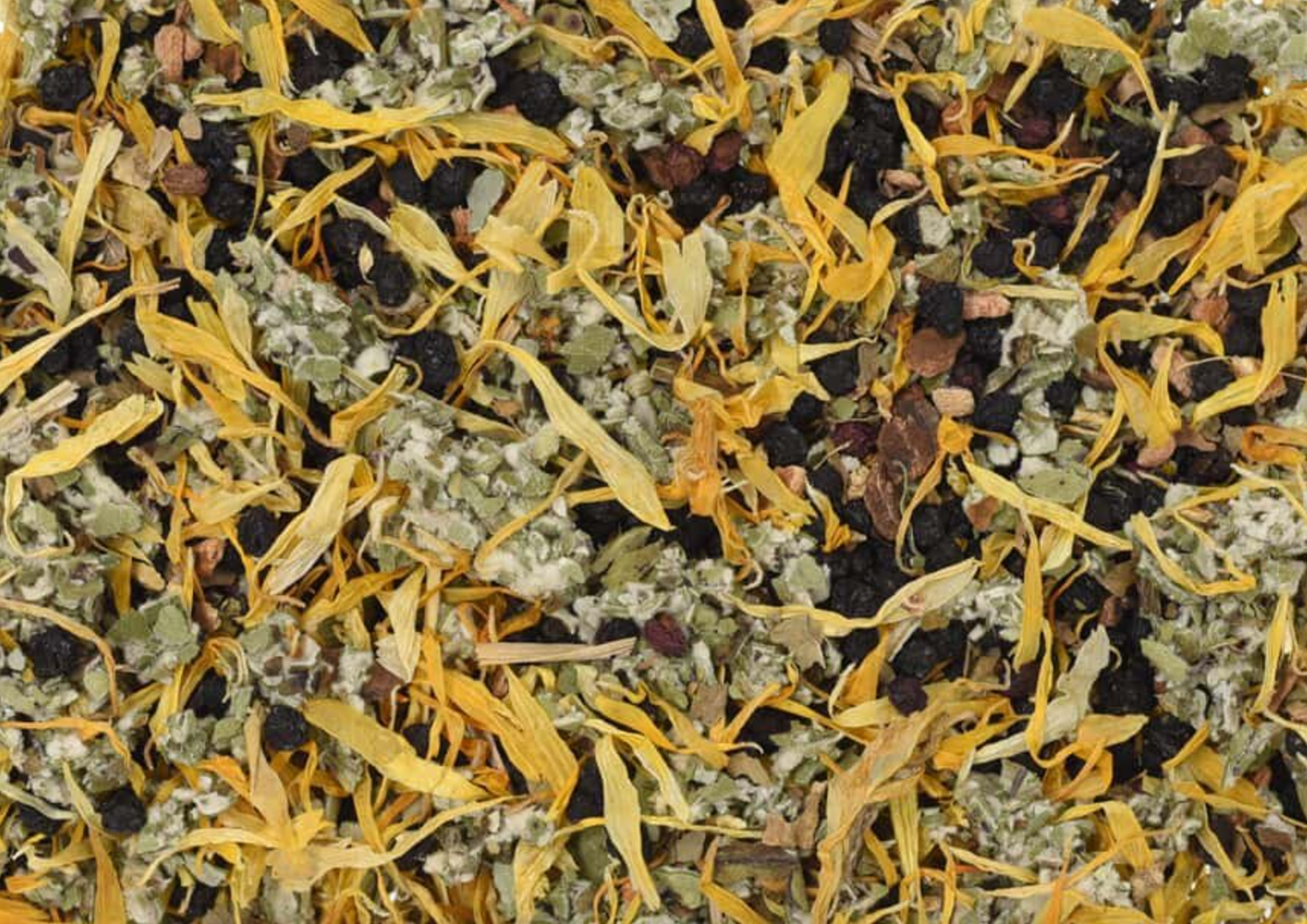 Close-up texture of Cough and Cold Tea, showing berries, bark, and leaves used for teas and herbal remedies.