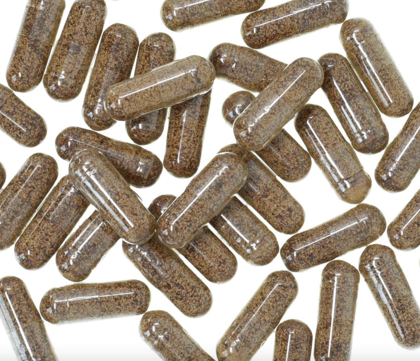 Reishi mushroom capsules with clear glossy shells, filled with brown powder, used for natural health and wellness.