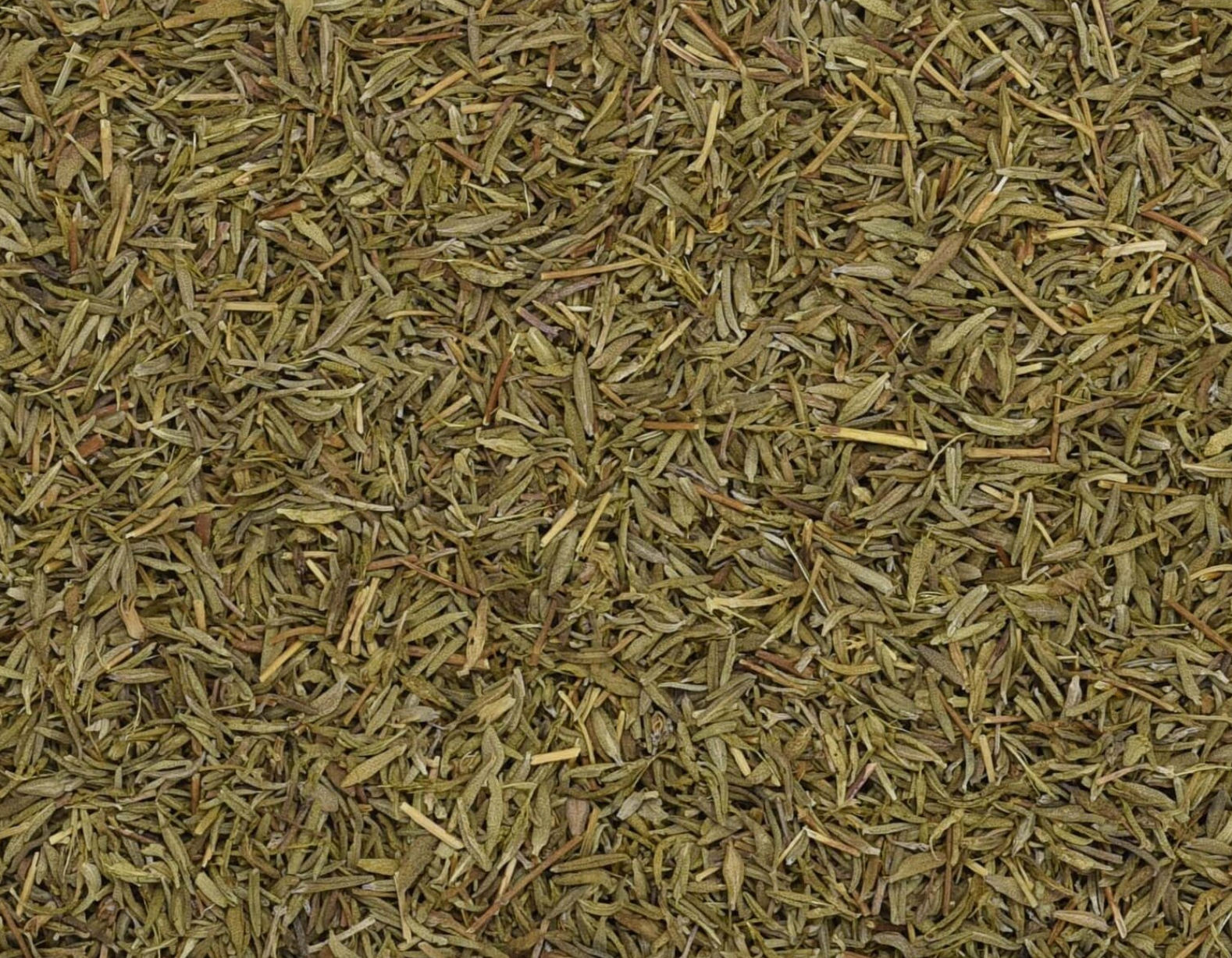 Close-up of dried thyme herb, showing tiny green leaves used for teas and herbal remedies.
